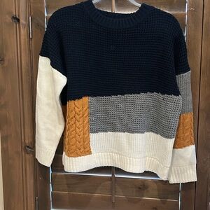 Pullover in navy/gray/dark gold/ cream abstract color block. Size M.